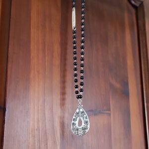 Silver and Black Beaded Pendant Necklace With Intricate Design